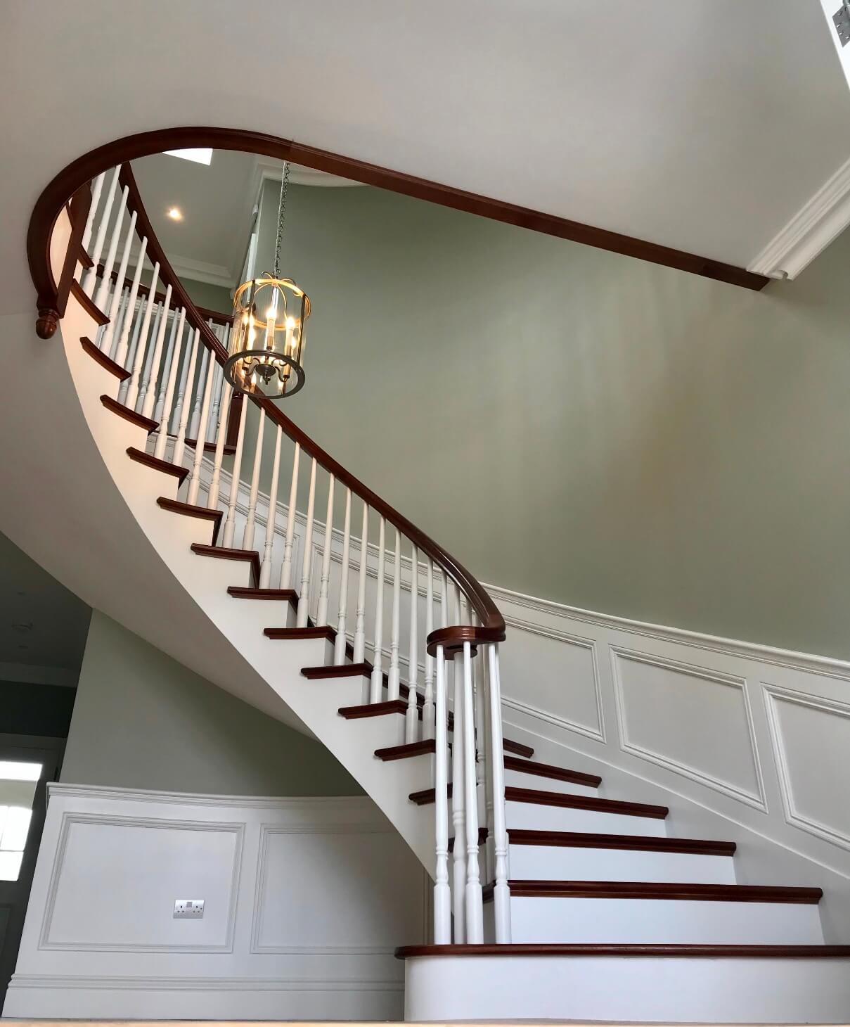 Curved Concrete Stairs Kilkenny Ireland - mahogany treads and